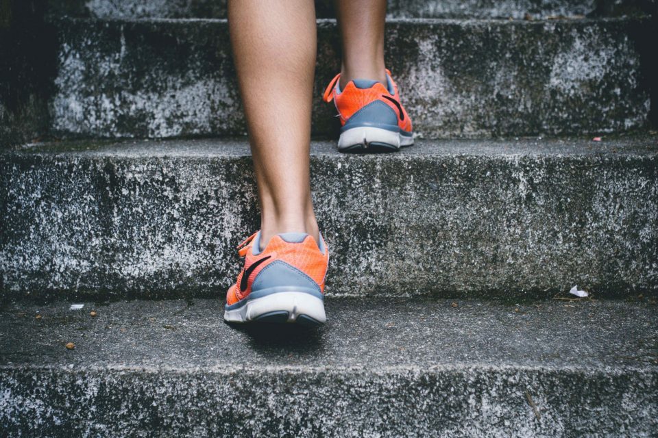 Act As If - woman climbing stairs